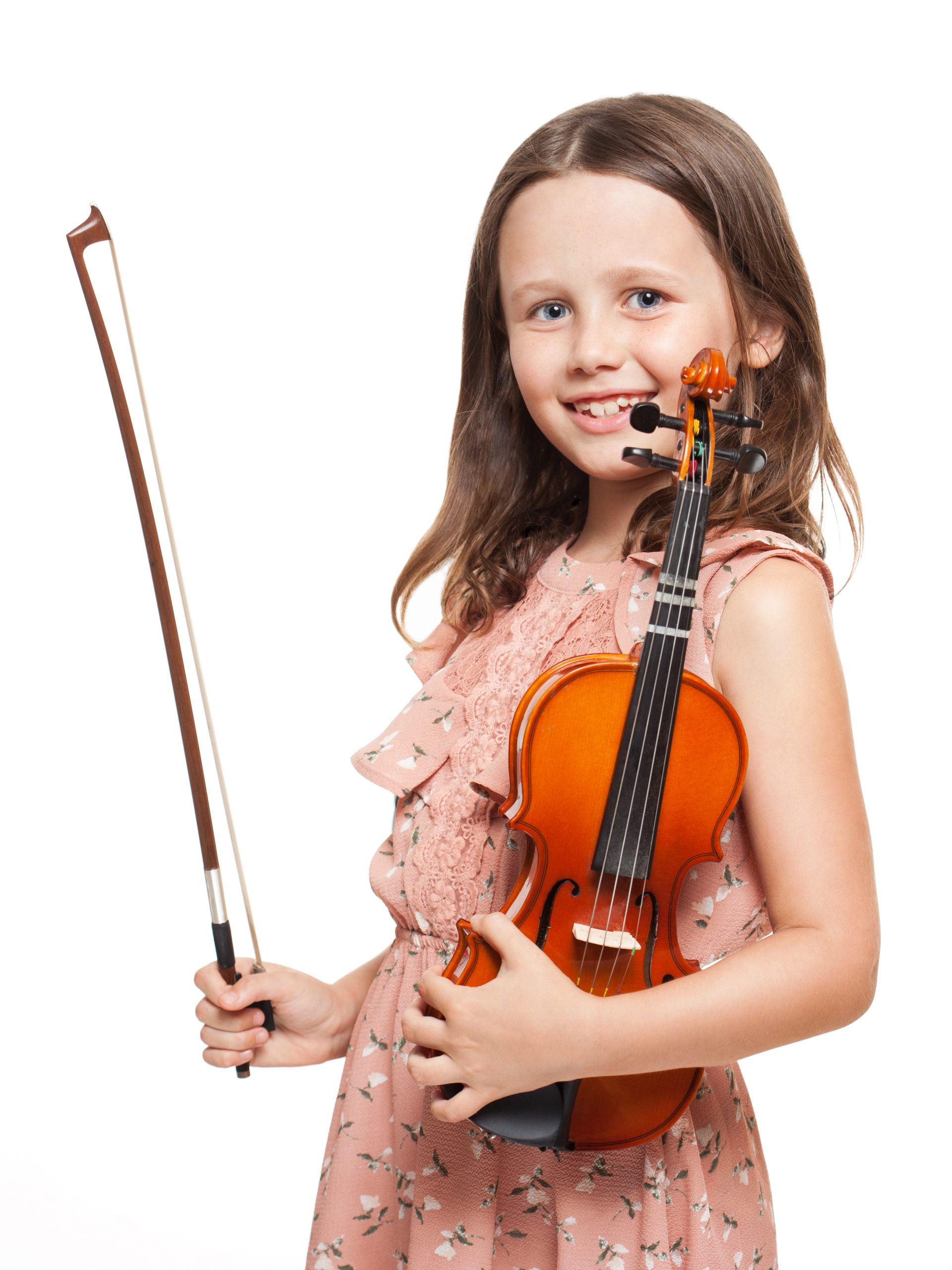 Portrait of a cute brunette girl playing violin.